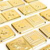 Set de domino metalic în culori aurii